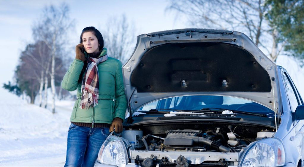 woman car battery e1516042335709